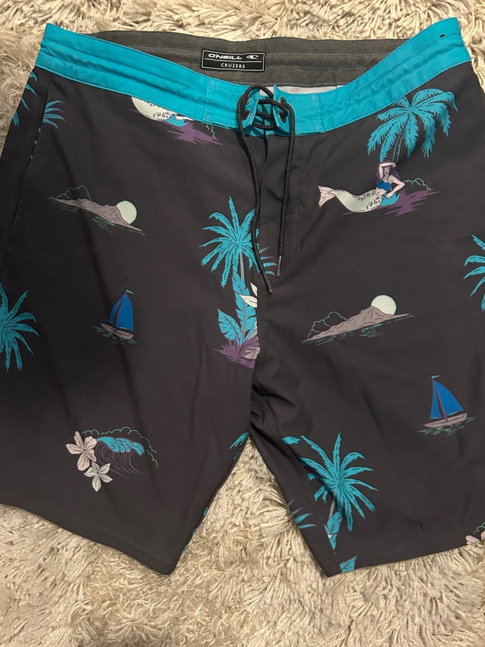 O'Neill Cruisers Black baggies, Board Shorts with Teal Tropical Print